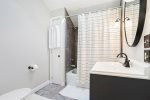 Primary bathroom suite with a shower tub combo